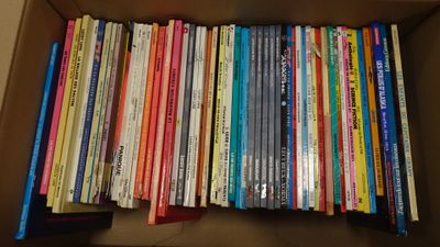 a box full of books sitting on a table