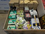 a wooden box filled with assorted electronics and other items