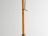 an image of a wooden pen with a metal handle on a white surface