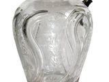 a clear glass pitcher with a black lid on a white background
