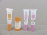 three different types of sunscreen creams and a tube of sunscreen cream