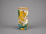 a vase with a picture of a man riding a horse on it