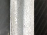 a close up of a piece of metal on a table