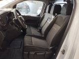 the interior of a white car with black leather seats and a steering wheel