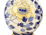 two vases that have been decorated with blue and white flowers