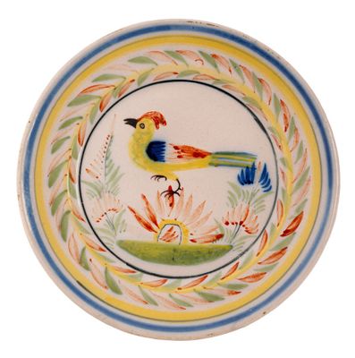 a colorful plate with a bird on it on a white background