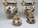 two vases with handles and handles are sitting next to each other