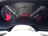 a close up of the dashboard of a car with the gauges on