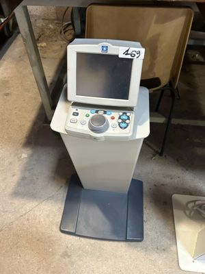 a machine that is sitting on the floor next to a chair