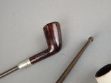 a pipe and a pipe holder on a table