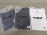 three t - shirts with the word fincut on them are sitting on a couch