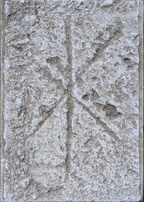 cement tile with a snowflake design on it