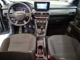 the interior of a car with a steering wheel, dashboard, and dash board