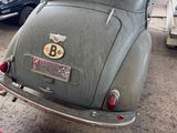 an old car with a number plate on the back of it