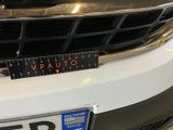 a close up of a number plate on the front of a car