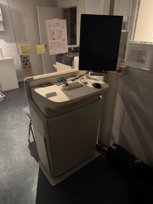 an image of a computer desk with a monitor on it