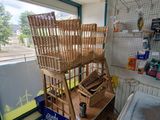 a basket on a shelf in the corner of a room