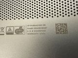 a close up of a metal plate with a qr code on it