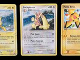three pokemon cards with different designs on them on a black background