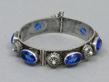 silver bracelet with blue stones and filigrees