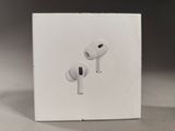 a white box with two airpods on top of it