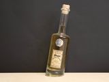 a bottle of olive oil sitting on a table