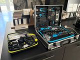 a case with tools on a table in a room