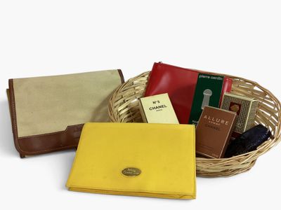 a basket with books, a wallet, and a purse