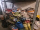 a room with a bunch of bags on the shelves