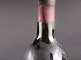 a bottle of wine that has been left on the table