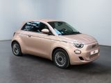 an image of a pink smart car parked in a showroom