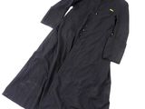 a black trench coat with a yellow patch on the collar and cuffs
