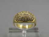 a close up of a gold ring with diamonds on it