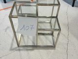 a glass table with a sign on it in the middle of a room