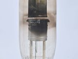 a glass tube with a wooden base on a white background