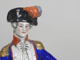 a figurine of a man in a military uniform