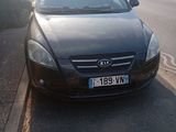 a black car parked on the side of the road