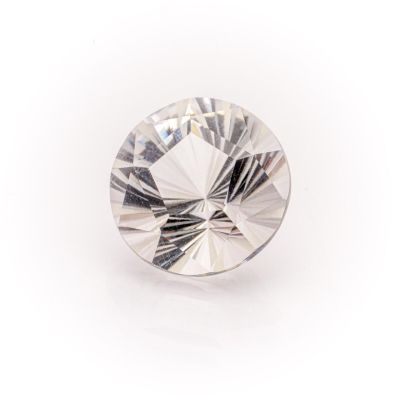 a close up of a diamond on a white surface