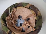 a small bowl with a stuffed animal inside of it