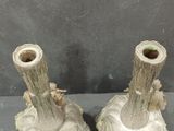 two vases that are sitting next to each other on a table