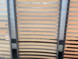 three wooden slats are lined up against a white wall