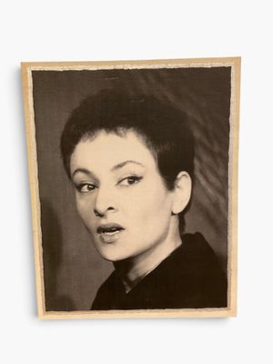 a black and white photo of a woman with short hair