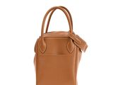 the small leather tote bag is made from a soft tan leather