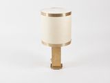 a white and gold table lamp with a wooden base