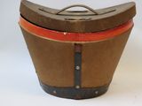 an old wooden box with a lid on a white surface