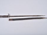 two tools that are sitting on a white surface