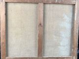 an old window frame with a window pane on the outside