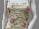 an image of a mannequin wearing a white dress with pink flowers on it