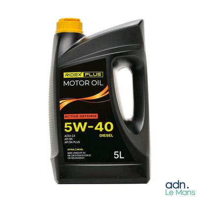 a close up of a bottle of motor oil on a white background