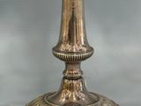 a silver candelab with two candles on it